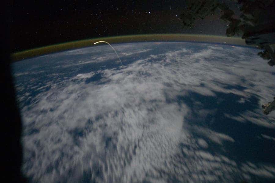 Shuttle Atlantis as it enters Earth's glowing atmosphere. Click for a better, larger view. (c) NASA/Johnson Space Center