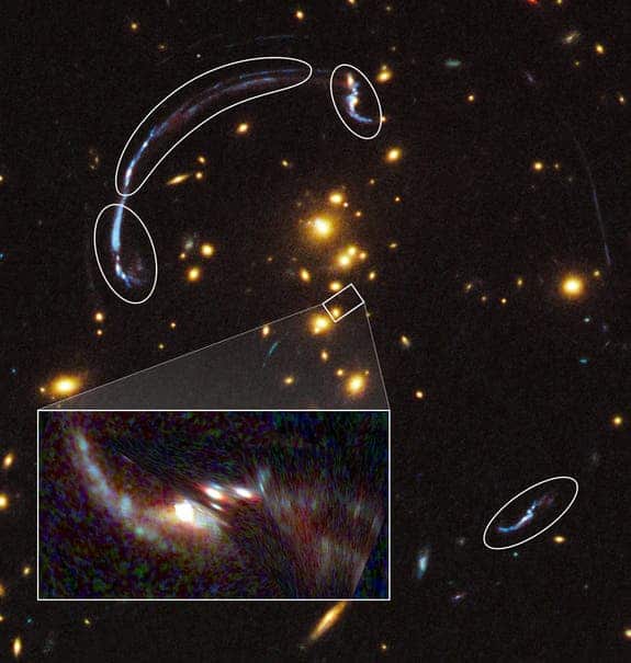 The zoom in rectangle shows the brightest galaxy so far found through a gravity lens. It's 20 times larger and over three times brighter than typically lensed galaxies.The rounded outlines that form an arc are actually the remnant distortions discussed in the article. (c) NASA