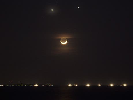 Venus and Jupiter cuddle in the night sky
