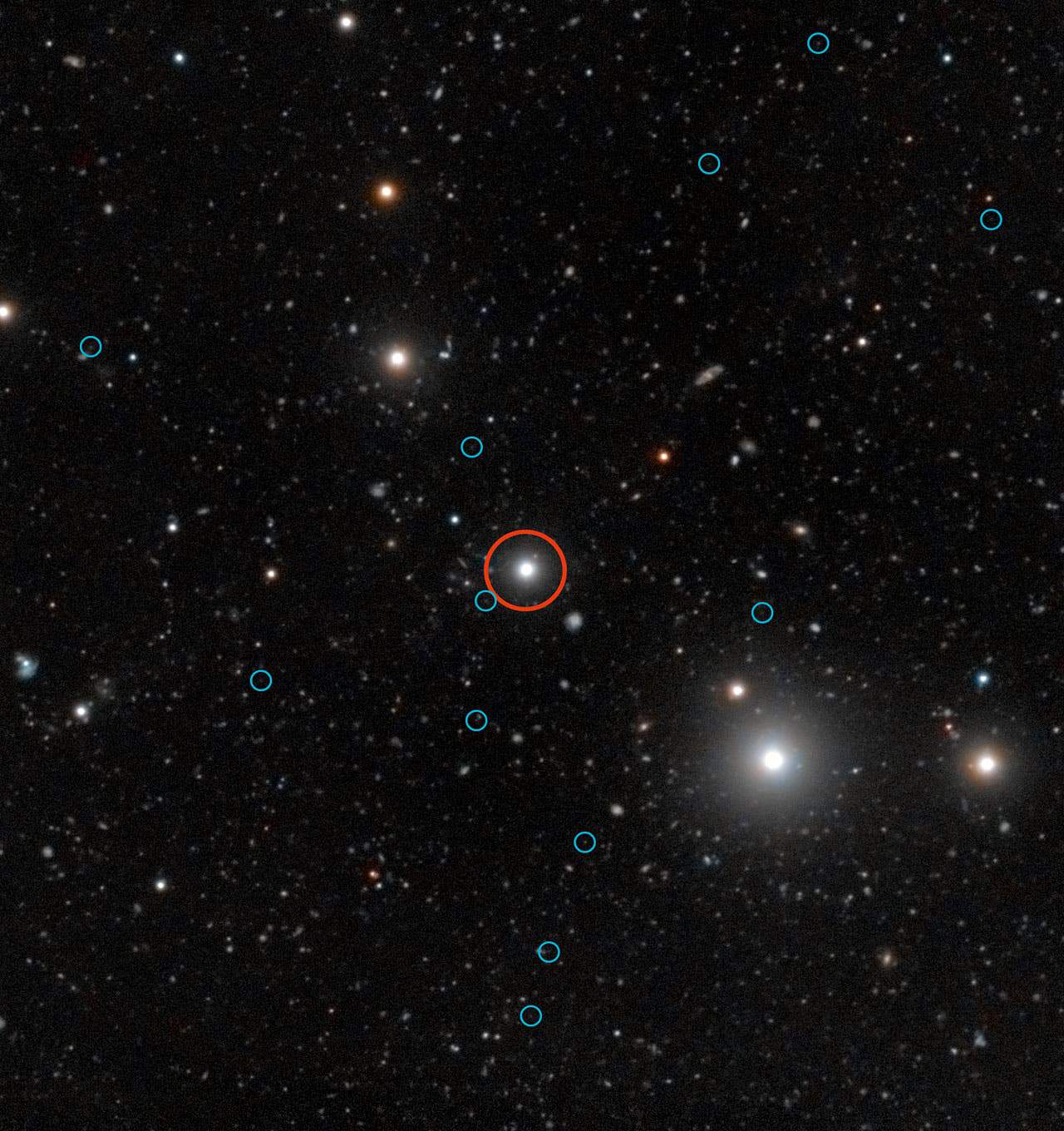 This deep image shows the region of the sky around the quasar HE0109-3518. The quasar is labelled with a red circle near the centre of the image. The energetic radiation of the quasar makes dark galaxies glow, helping astronomers to understand the obscure early stages of galaxy formation. The faint images of the glow from 12 dark galaxies are labelled with blue circles Click for ZOOM. (C) ESO