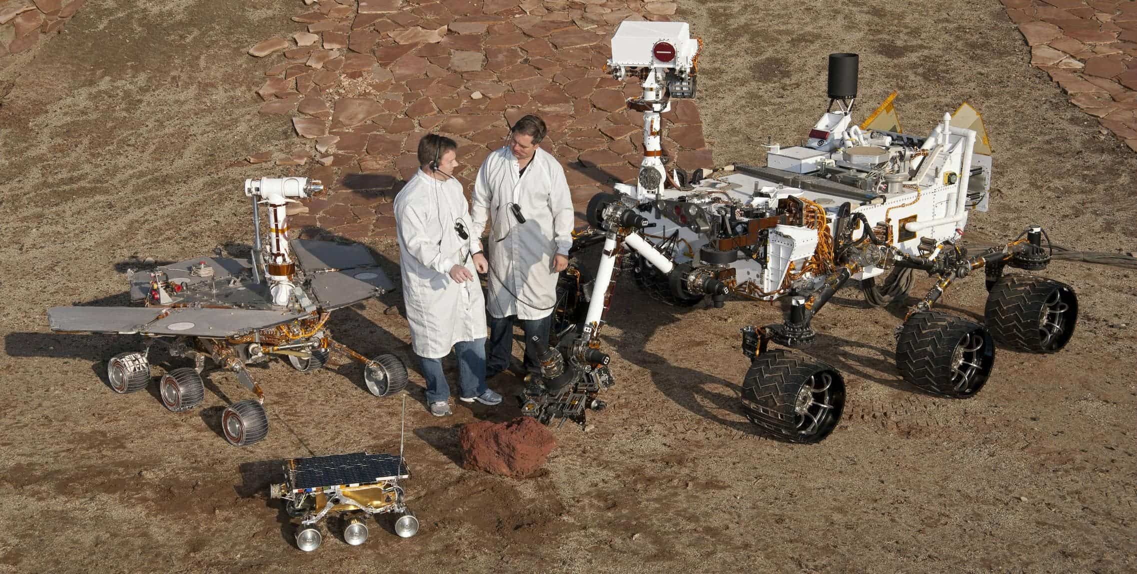 A picture that gives you an estimate of how big Curiosity really is, compared to two scientists and other rovers. Click the picture for full size. Source