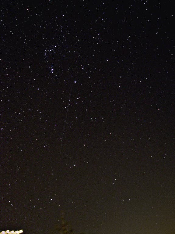Photographer Charlie Prince snapped this photo of an Orionid meteor over Edwards, Calif., on Oct. 21, 2012, during the peak of the 2012 Orionid meteor shower. He used a Canon PowerShot S5 IS on a Celestron CG-5GT equatorial mount, with settings at F2.7 ISO 400, 64-second exposure.