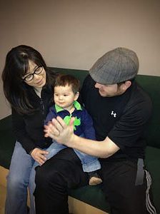 Baby Leif (centre, pictured with parents Harumi Inokoshi and Eric Roe) is growing up bilingual, hearing Japanese from his mother and English from his father.  (Photo: Janet Werker, UBC Infant Studies Centre)