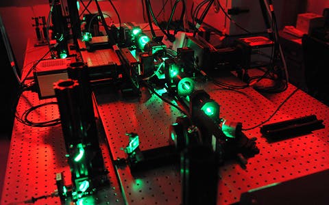 A SiMView microscope uses lasers to illuminate specimens while two cameras to the left and to the right of the central imaging chamber capture shots of the specimen’s cells from different angles. 