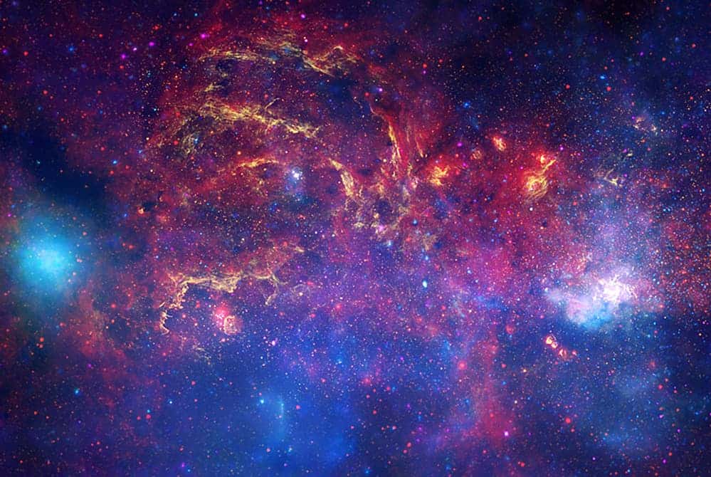 This composite image combines observations using infrared light and X-ray light that see through the obscuring dust and reveal the intense activity near the galactic core.
IMAGE: X-RAY: NASA/CXC/UMASS/D. WANG ET AL.; OPTICAL: NASA/ESA/STSCI/D.WANG ET AL.; IR: NASA/JPL-CALTECH/SSC/S.STOLOVY