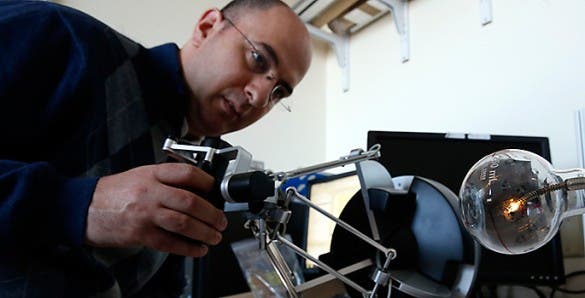 Nabil Simaan testing a surgical robot that he designed. (Joe Howell / Vanderbilt)