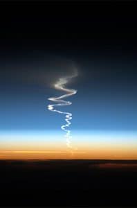 Trailing exhaust and water vapor remnants from the Russian ICBM launch. The wobbly path is because varying currents in the atmosphere. 