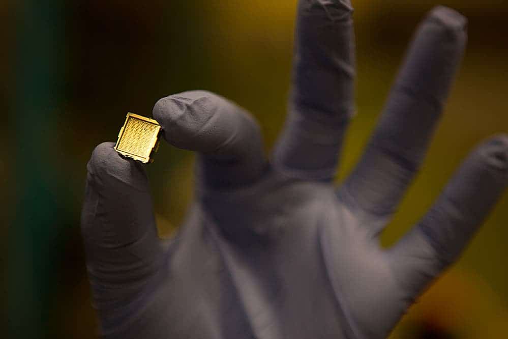 Lozano holds a prototype of a microthruster, developed to propel small satellites in space. PHOTO: BRYCE VICKMARK