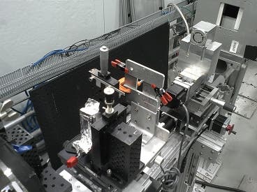 The team's small prototype neutron microscope is shown set up for initial testing at MIT's Nuclear Reactor Laboratory. The microscope mirrors are inside the small metal box at top right. 
