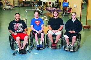 Left to right: Andrew Meas, Dustin Shillcox, Kent Stephenson and Rob Summers, the first four to undergo task-specific training with epidural stimulation at the Human Locomotion Research Center laboratory, Frazier Rehab Institute, as part of the University of Louisville's Kentucky Spinal Cord Injury Research Center, Louisville, Kentucky. Photo courtesy of the University of Louisville
