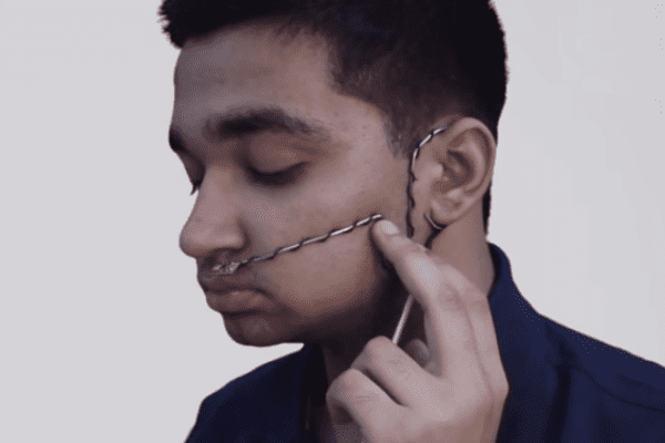 In photo: sixteen year old inventor  Arsh Shah Dilbagi demonstrating his breath to voice synthesizer. 