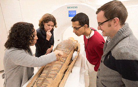Curators and radiologists examine the mummy of Pet-Menekh on Sunday, Oct. 12, at Washington University Medical Center. From left are Lisa Çakmak, PhD, assistant curator of ancient art at Saint Louis Art Museum; Karen K. Butler, PhD, associate curator of Washington University’s Mildred Lane Kemper Art Museum; Sanjeev Bhalla, MD, professor of radiology and chief of cardiothoracic imaging at the School of Medicine; and Vincent Mellnick, MD, a Washington University radiologist. Pet-Menekh was scanned in a computerized tomography (CT) scanner at the medical center.