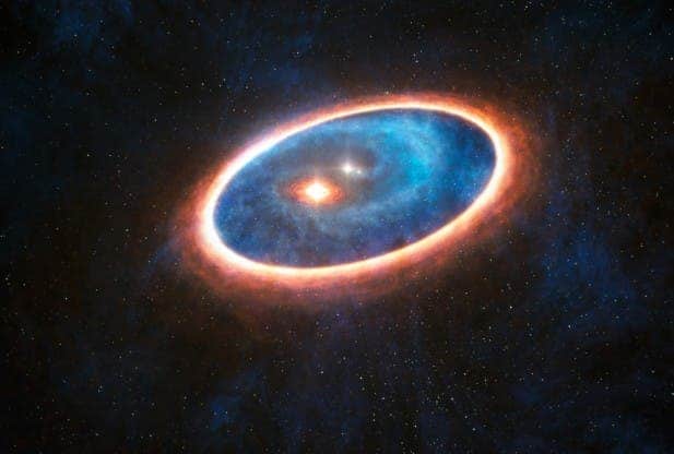his artist's impression shows the dust and gas around the double star system GG Tauri-A. Credit: ESO/L.Calçada