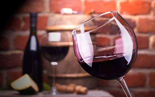 A glass of wine may do wonders for your health - but more will certainly harm it. Image via The Telegraph.
