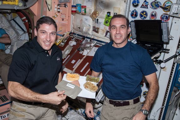 A spread of Thanksgiving dishes aboard the International Space Station in 2013.  Credit: NASA