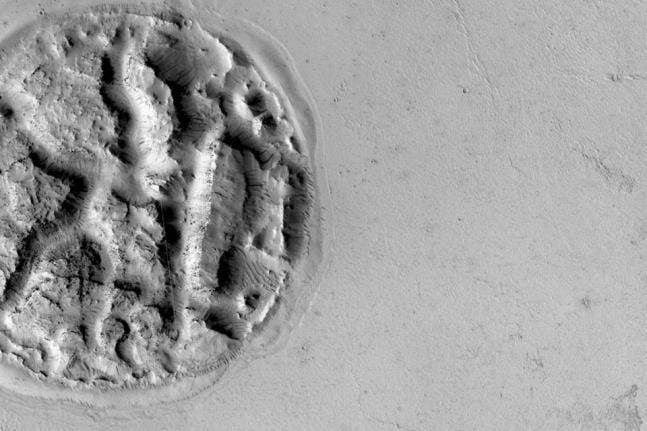 NASA's MRO probe captured an image of a strange formation that resembles a pie. Photo by NASA/JPL.