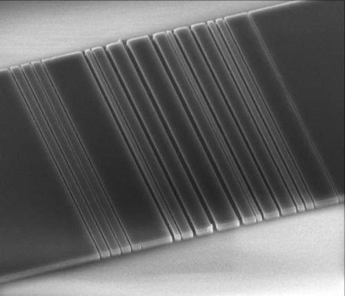 This tiny slice of silicon etched with a bar-code pattern might one day lead to computers that use light instead of wires. Image: Vuckovic Lab