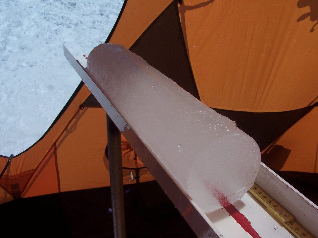 A section of ice core that researchers at The Ohio State University extracted from the Quelccaya Ice Cap in Peru in 2003. Though the ice appears pristine, it contains evidence of human-produced air pollution from as early as the 16th Century. Photo by Paolo Gabrielli, courtesy of The Ohio State University.