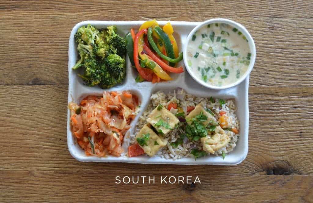 Fish soup, tofu over rice, kimchi and fresh veggies.