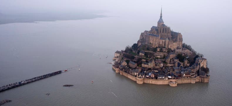 A supertide envelopes Mont Saint-Michel. Associated Press
