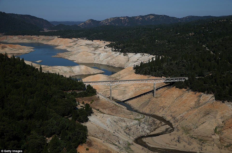 Here, the Enterprise Bridge spans the same reservoir, which has dwindled to a mere trickle in 2014 as California is forced to draw alarming amounts of water from its vanishing reservoirs.