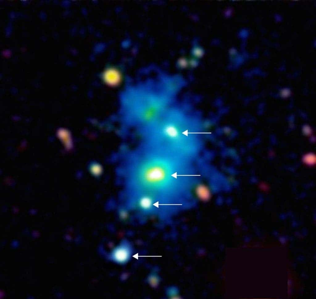 It's like winning the lottery - twice. Astronomers have spotted a rare cluster of four quasars—some of the brightest objects in the universe, formed from active black holes. Photograph by Hennawy and Arrigoni Battaia, MPIA.