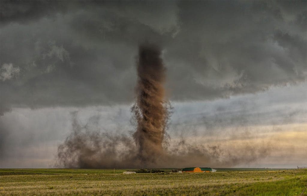 Photo and caption by James Smart /National Geographic Traveler Photo ContestBeautiful tornado tracks in open farm land narrowly missing a home near Simla, Colorado.