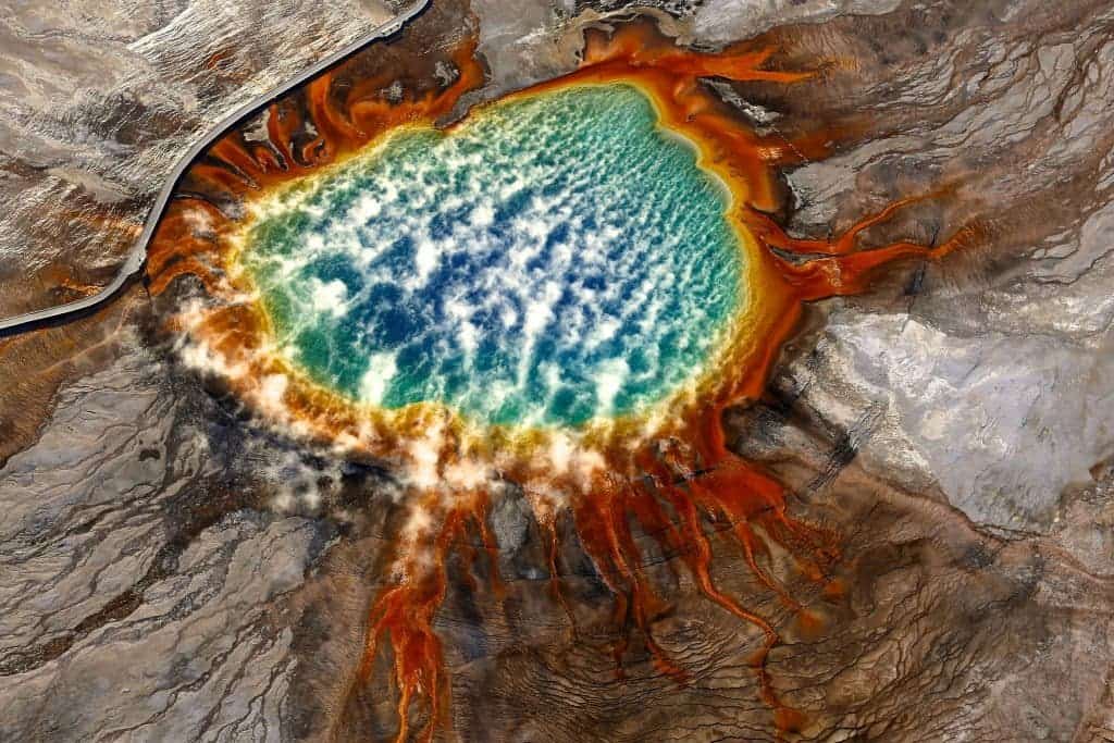 Photo and caption by Jassen T. /National Geographic Traveler Photo ContestSunrise at Grand Prismatic Spring, Yellowstone National Park, Wyoming. Aerial Image. If you look carefully, you might notice the person enjoying this natural beauty.