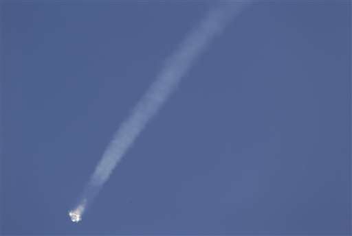  SpaceX Falcon 9 rocket and Dragon spacecraft breaks apart shortly after liftoff . AP Photo/John Raoux