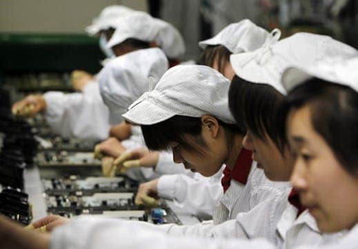 A 2010 photo shows assembly line workers at a Foxconn plant in Shenzhen, a city in southern China. Shifts are 12 hours, with two breaks for meals at a company cafeteria. Robots don't have to eat though or take a break. Hence robots are better. 