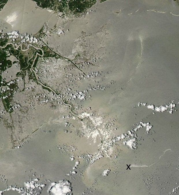 A 32-mile-long oil slick stretches east from the former site of Taylor Energy's Mississippi Canyon 20 A platform (X), which was knocked down and covered by a landslide during Hurricane Ivan in 2004. (NASA Aqua satellite)