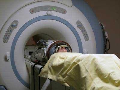 A patient undergoing treatment with the new HIFU system, under surveilance by an MRI machine.
Image via medgadget