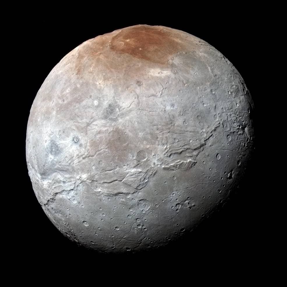 Charon in Enhanced Color NASA's New Horizons captured this high-resolution enhanced color view of Charon just before closest approach on July 14, 2015. The image combines blue, red and infrared images taken by the spacecraft’s Ralph/Multispectral Visual Imaging Camera (MVIC); the colors are processed to best highlight the variation of surface properties across Charon. Charon’s color palette is not as diverse as Pluto’s; most striking is the reddish north (top) polar region, informally named Mordor Macula. Charon is 754 miles (1,214 kilometers) across; this image resolves details as small as 1.8 miles (2.9 kilometers).
Credits: NASA/JHUAPL/SwRI