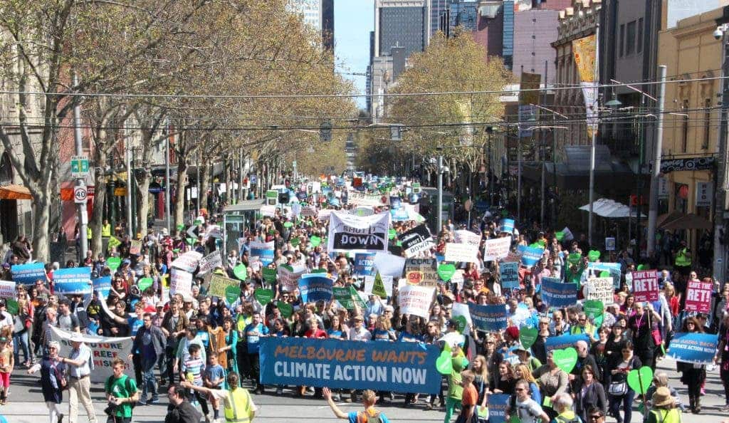 People marching for action against climate change. Image via Wikipedia.
