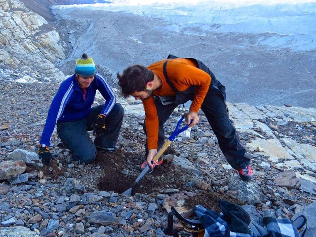 Researchers work in Greenland to instill seismic activity detectors, buried into glacier sediment. 
Credit:Timothy Bartholomaus
