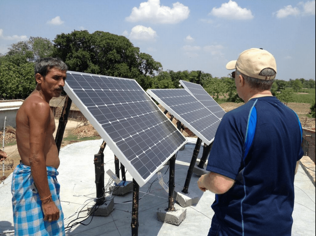 Solar panels in an off-grid Indian village. Image via Wikipedia.
