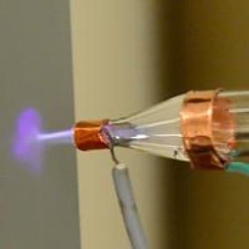 The nozzle firing a jet of carbon nanotubes with helium plasma off and on. When the plasma is off, the density of carbon nanotubes is small. The plasma focuses the nanotubes onto the substrate with high density and good adhesion.
Image credits NASA Ames Research Center.