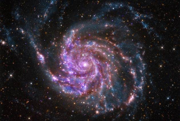Data from galaxies such as M101, seen here, allow scientists to gauge the speed at which the universe is expanding.
Image credits X-ray: NASA/CXC/SAO; Optical: Detlef Hartmann; Infrared: NASA/JPL-Caltech