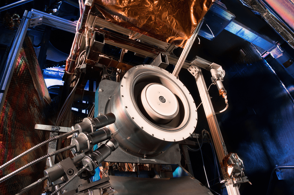 Advanced solar electric propulsion will be needed for future human expeditions into deep space, including to Mars. Shown here is a 13-kilowatt Hall thruster being evaluated at NASA’s Glenn Research Center in Cleveland. Hall thrusters trap electrons in a magnetic field and use them to ionize the onboard propellant. It uses 10 times less propellant than equivalent chemical rockets.