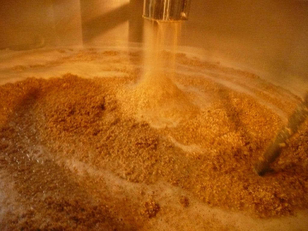  Beer mash being mixed in a brewery vat. Image via flickr user epicbeer.