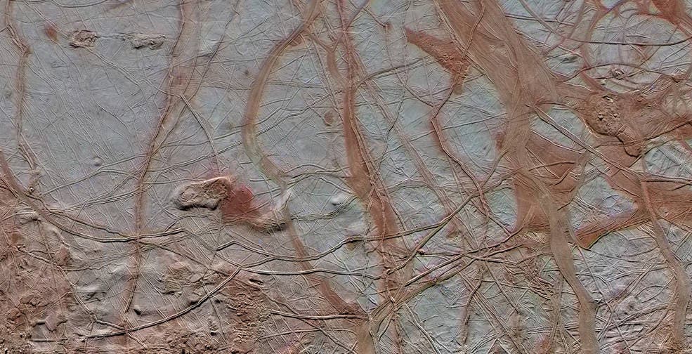 This enhanced-color view from NASA's Galileo spacecraft shows an intricate pattern of linear fractures on the icy surface of Jupiter's moon Europa.
Credits: NASA/JPL-Caltech/ SETI Institute