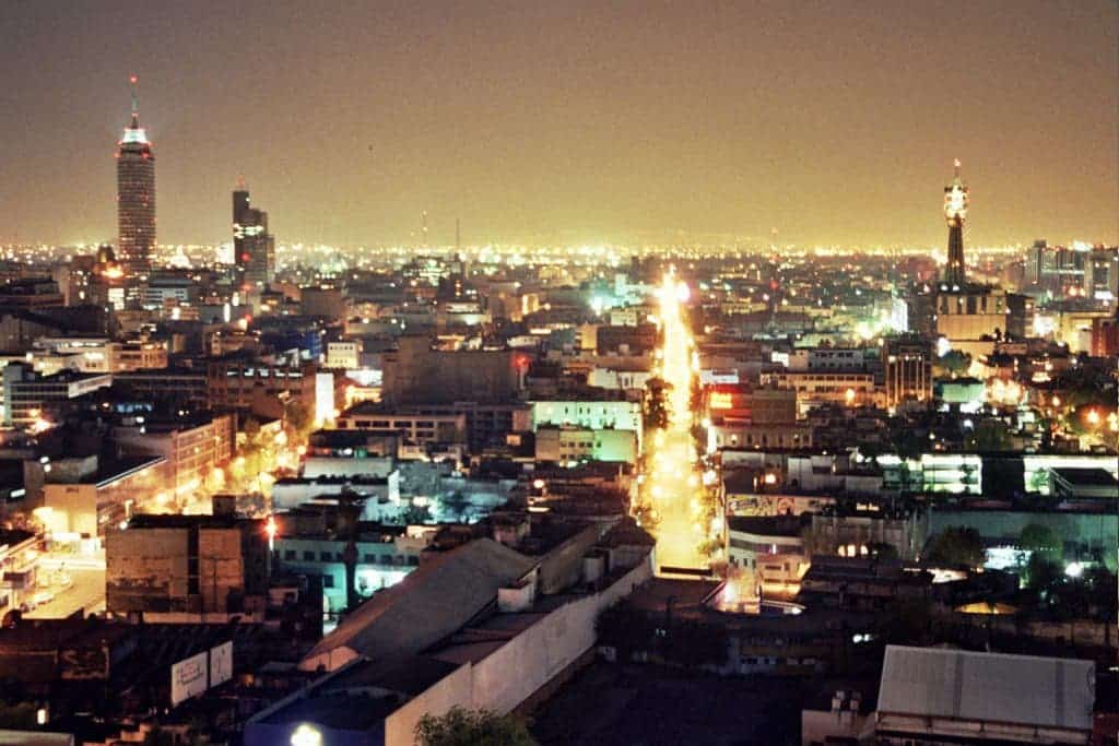 Mexico City at night, with a brightly illuminated sky. Photo by Fernando Tomás.