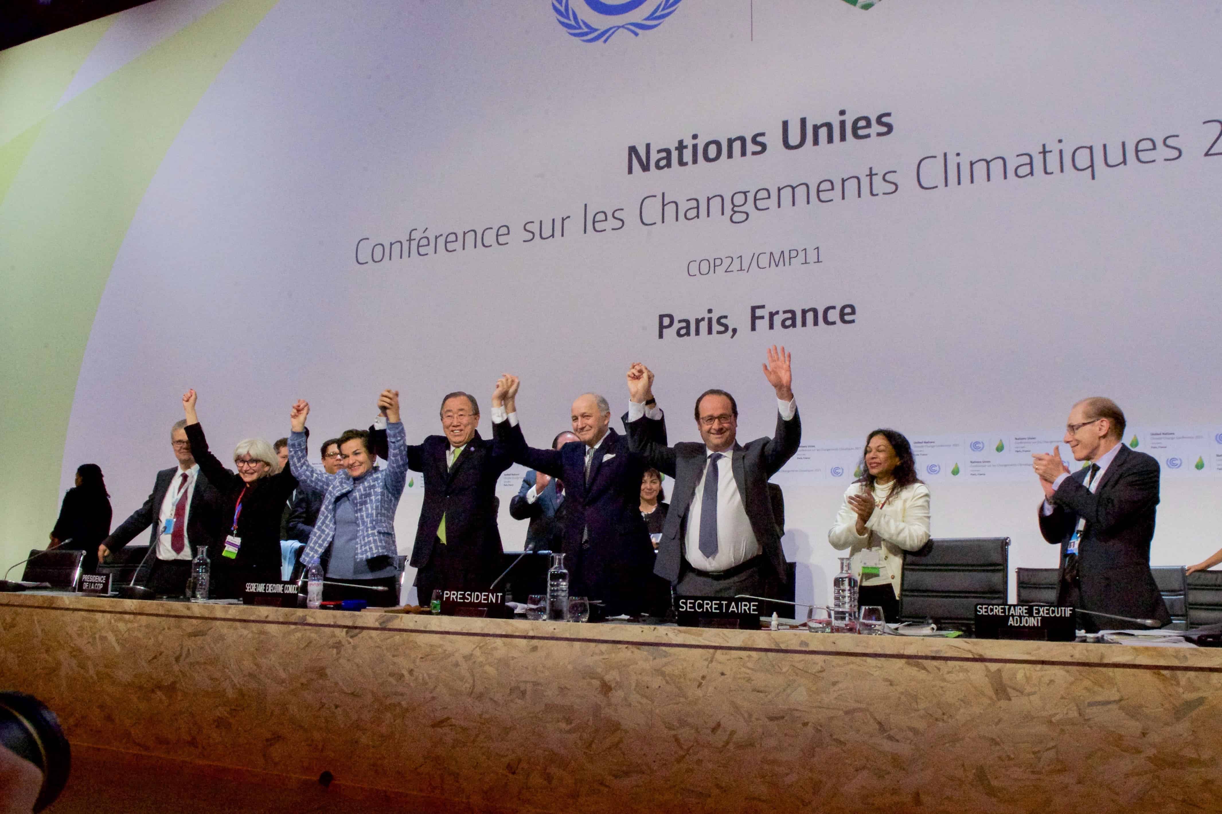 Heads of state cheer after the Paris Climate Change Agreement was signed at COP21, 2015, by 197 parties. Credit: Wikipedia