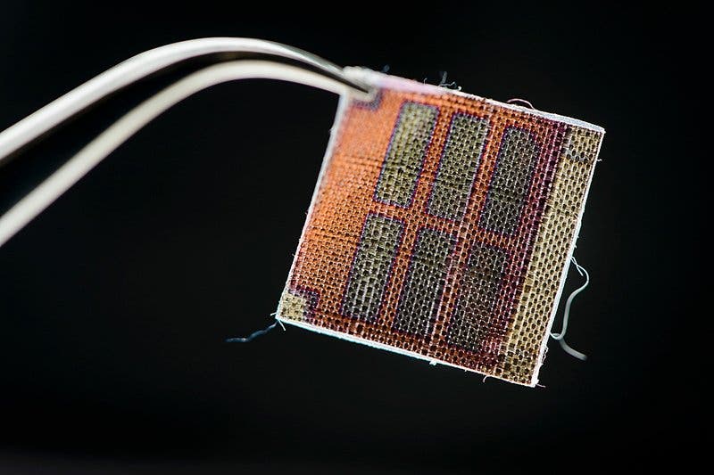 Six rectangular cells made from conductive polymer coated onto a fabric. Credit: Jeff Miller/UW-Madison