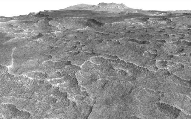 The new huge ice deposit was found beneath scalloped depressions in a part of Mars. To find the buried ice, the researchers used ground-penetrating radar aboard NASA's Mars Reconnaissance Orbiter. Credit: NASA/JPL-Caltech/Univ. of Arizona