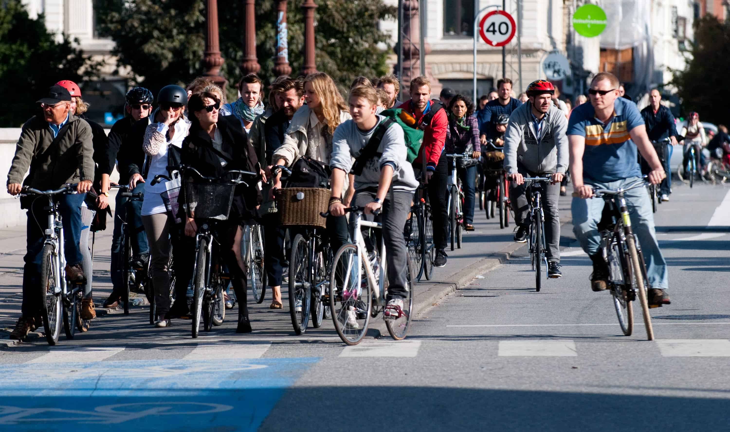 Cyclists in Copenhagen waiting for the green light. Credit: Wikimedia Commons