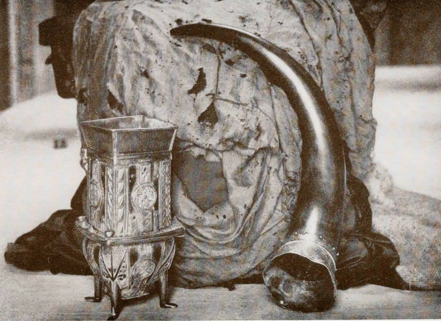 A photo of the Dunvegan Cup, Fairy Flag, and Rory Mor's Horn, all cherished heirlooms of the MacLeod clan. Photo by Roderick Charles MacLeod, 1927.