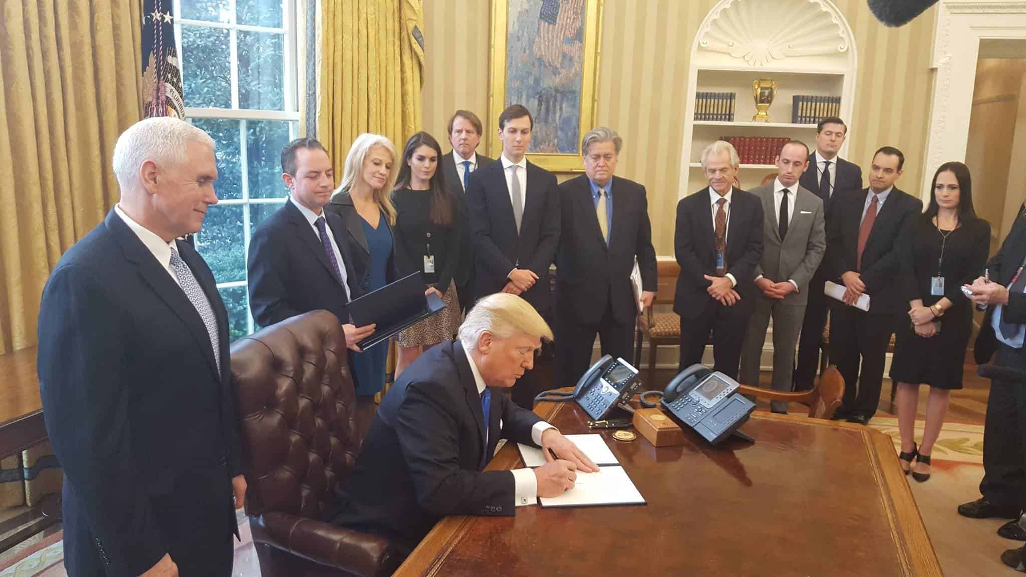 Donald Trump signs Executive Orders in January 2017. Credit: Wikimedia Commons.
