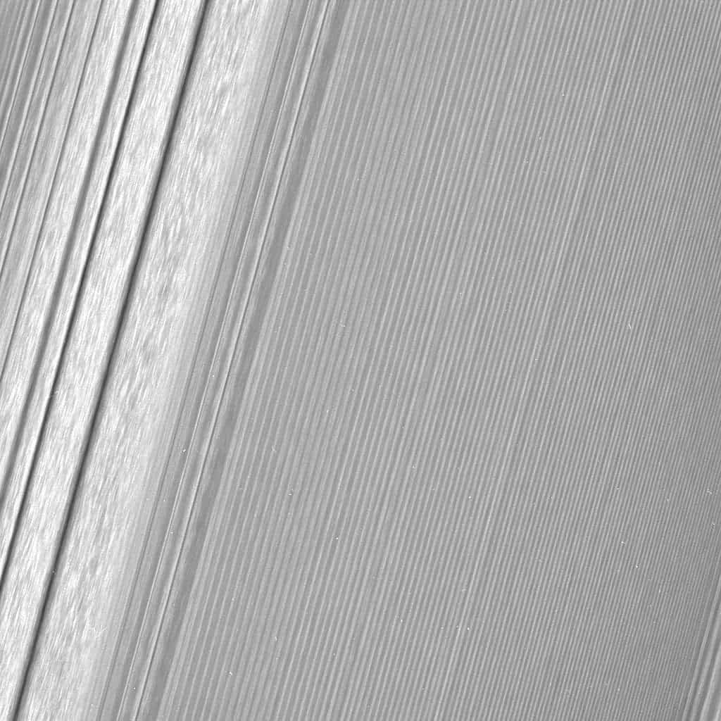 This Cassini image features a density wave in Saturn's A ring (at left) that lies around 134,500 km from Saturn. Density waves are accumulations of particles at certain distances from the planet. This feature is filled with clumpy perturbations, which researchers informally refer to as 