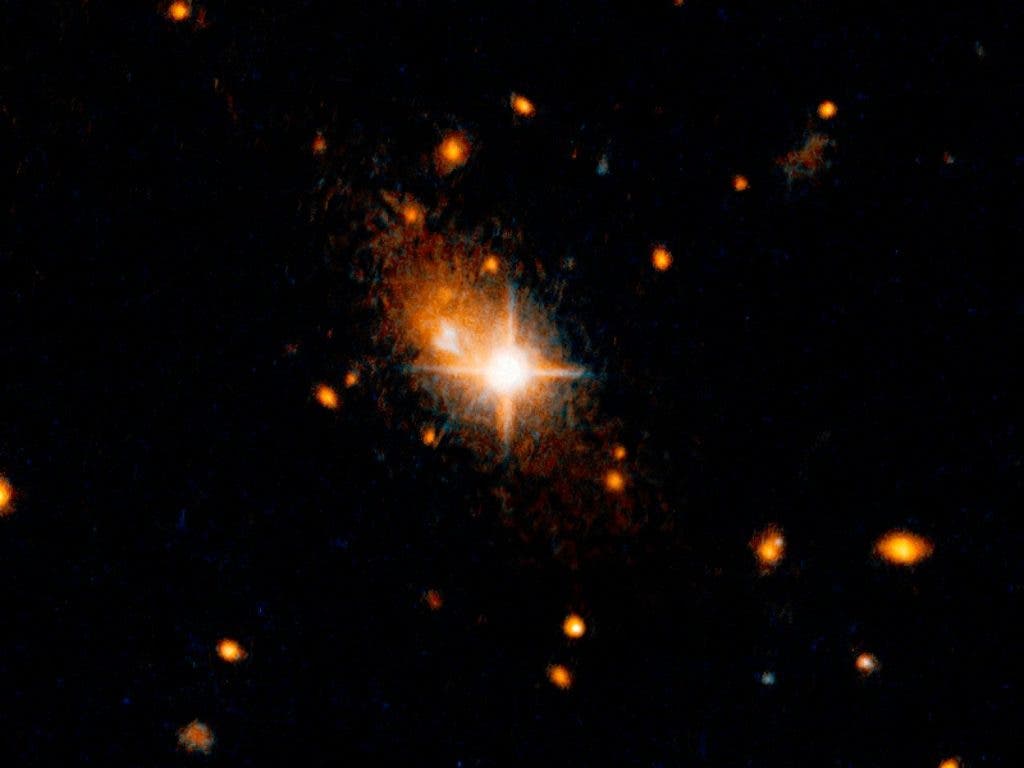 A supermassive black hole was ejected out of the distant galaxy 3C186 by the force of gravitational waves. Credit: NASA/ESA.